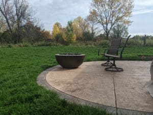 Fire feature firebowl on patio with chairs